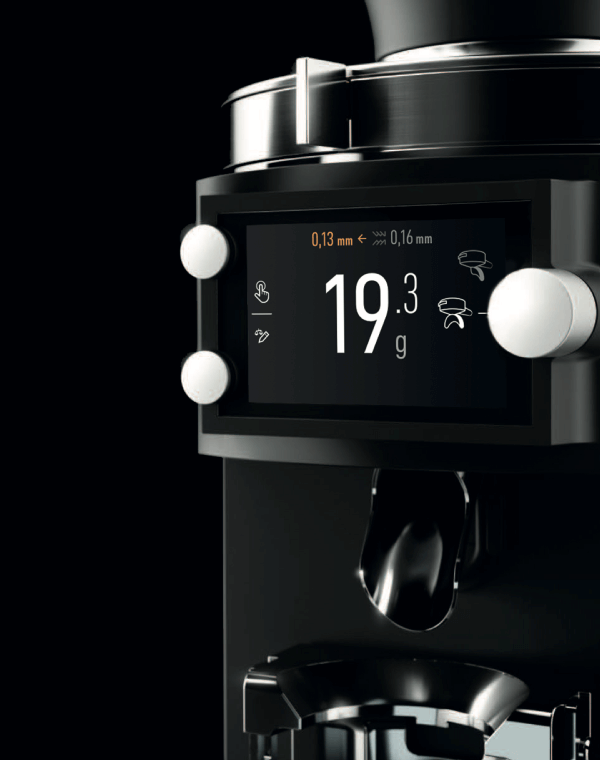 Rendered detail of the E65S Grind by Weight coffee grinder. The display shows the selected recipe with the set weight.