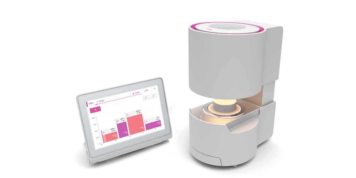 The white-pink oven Smart.Fire from Vita with a glowing lamp is to the left of its associated touchscreen with a light, flat UI.