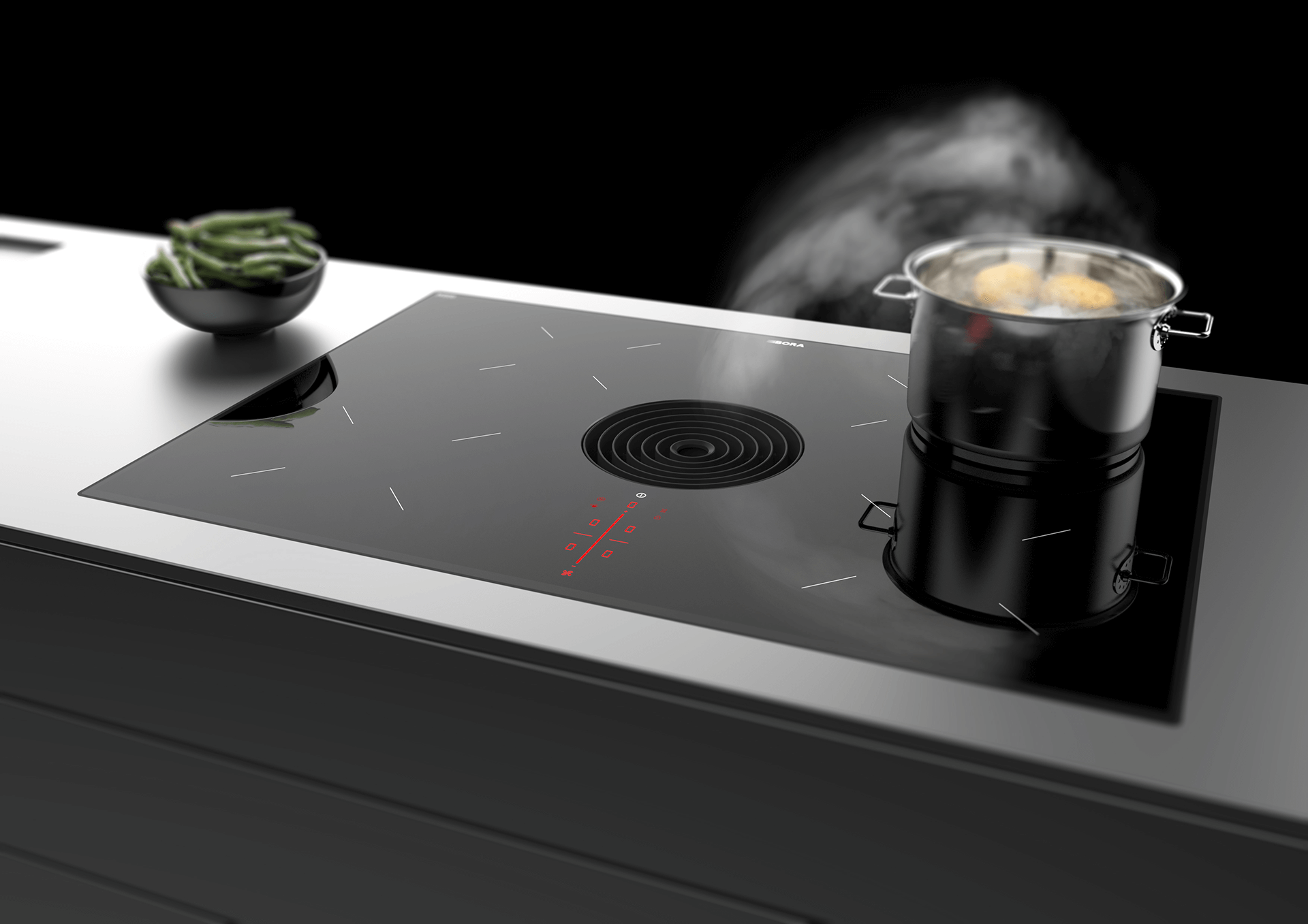 A BORA Pure with a black inlet nozzzle, which absorbs the steam from a boiling pan.