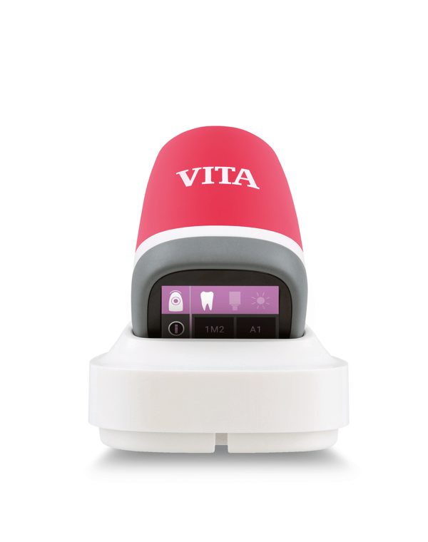 The Vita Easyshade is held in the camera with a focus on the user interface